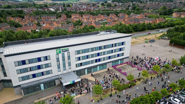 In this aerial view anti-racism counter protesters (left) and anti-migration protesters stand outside the Holiday Inn Express in Manvers, which is being used as an asylum hotel, in Rotherham. Picture: Getty Images