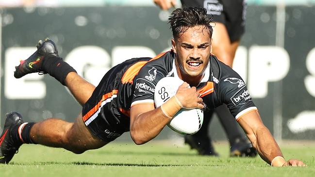 SYDNEY, AUSTRALIA - FEBRUARY 28: Daine Laurie of the Tigers  scores a try during the NRL Trial Match between the Wests Tigers and the Manly Sea Eagles at Leichhardt Oval on February 28, 2021 in Sydney, Australia. (Photo by Mark Kolbe/Getty Images)