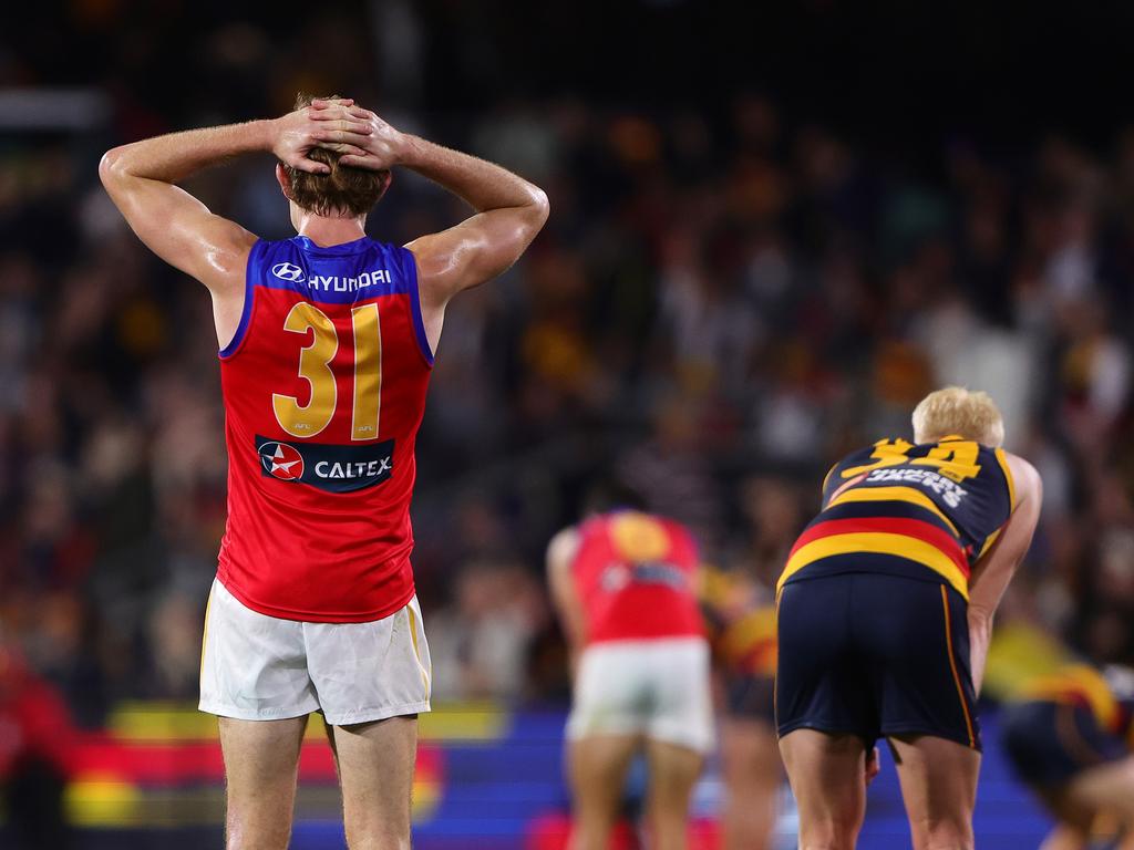 ADELAIDE, AUSTRALIA – MAY 12: Harris Andrews of the Lions and Elliott Himmelberg of the Crows react to the siren and the draw during the 2024 AFL Round 09 match between the Adelaide Crows and the Brisbane Lions at Adelaide Oval on May 12, 2024 in Adelaide, Australia. (Photo by Sarah Reed/AFL Photos via Getty Images)