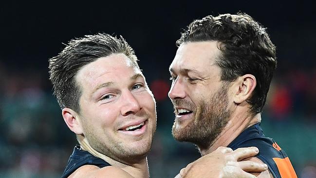 Toby Greene and Sam Reid after the Giants beat the Swans in last year’s finals series. (Photo by Steve Bell/AFL Photos/via Getty Images)