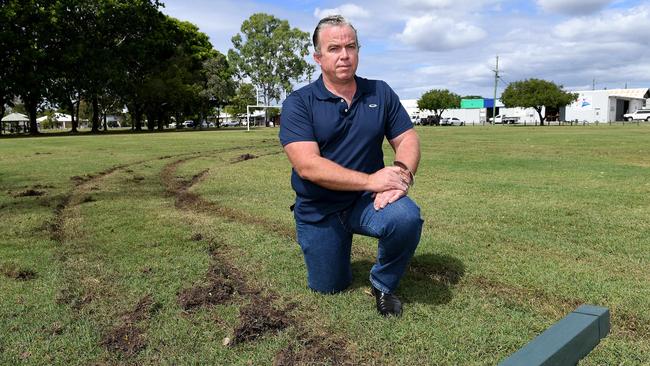 Local Steven Isles at Currajong park where stolen cars have ripped up the grass and knocked down boundary poles. Picture: Shae Beplate.