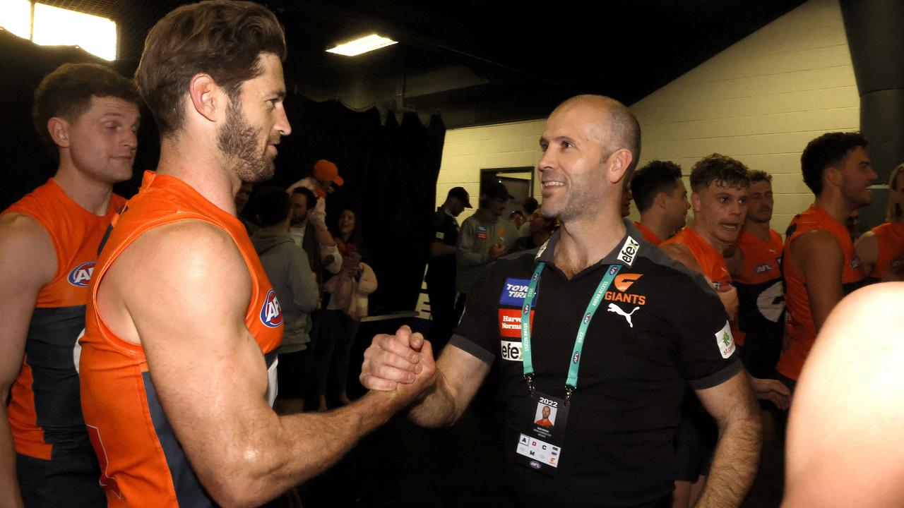 Giants interim coach Mark McVeigh celebrates in the rooms last week with Callan Ward after their win over Essendon. Picture: Phil Hillyard