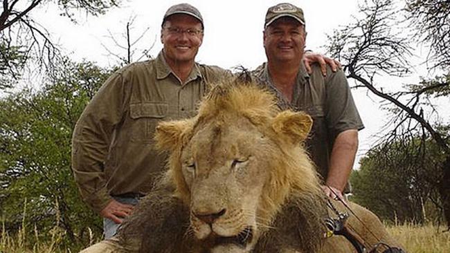 Walter J. Palmer (left) with one of his trophies. (man at right is unidentified) photo: facebook.