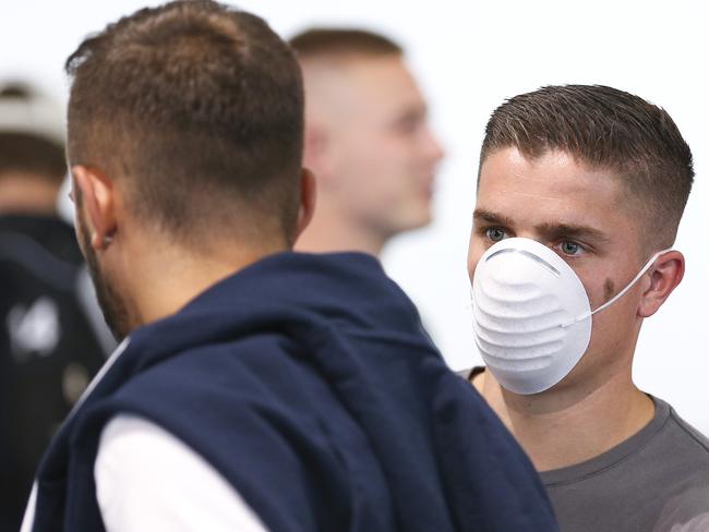 WELLINGTON, NEW ZEALAND - MARCH 18:  Cameron Devlin wears a face mask at Wellington Airport, prior to the departure of the Wellington Phoenix team to Sydney to complete the remainder of the Hyundai A-League season on March 18, 2020 in Wellington, New Zealand. (Photo by Hagen Hopkins/Getty Images)