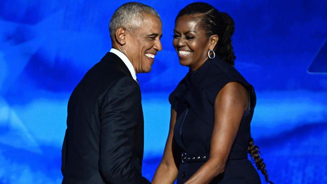 Former US president Barack Obama and wife Michelle on stage at the DNC in Chicago. Picture: AFP