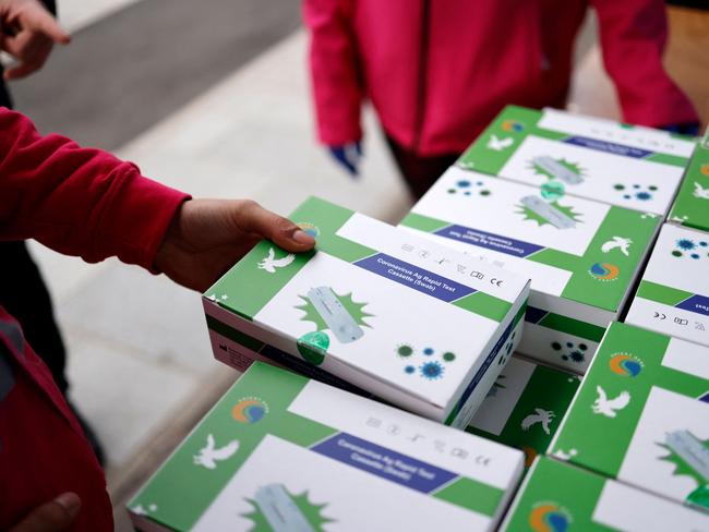 Boxes of RATs are available for free across the UK. Picture: Tolga Akmen/AFP