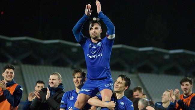 Brad Norton is chaired off after his 300th game. Picture: Mark Avellino