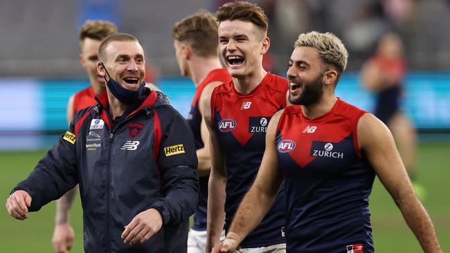 Coach Simon Goodwin, Bayley Fritsch and Christian Salem after Monday night’s win. Picture: Paul Kane/Getty Images