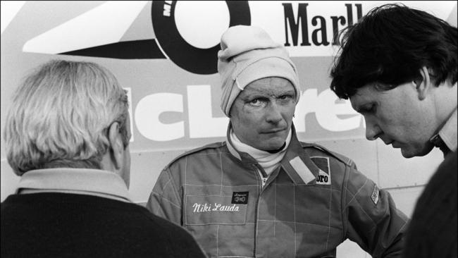 Austrian Fomula 1 champion driver Niki Lauda (C) talks to members of the MacLaren racing stable in 1981.