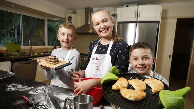 The siblings in their element at their home in Alexandra Hills. (AAP Image/Josh Woning)