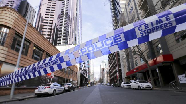 Police investigate the death scene at the EQ Arcade building on A'Beckett Street in Melbourne on Saturday. Picture: AAP