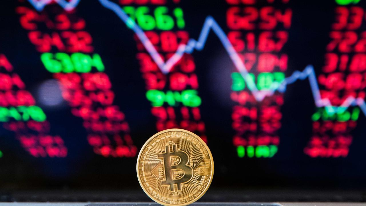 One in four Aussies are expected to own cryptocurrency this year. Picture: Jack Guez / AFP