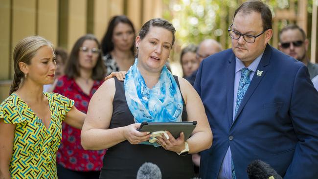 Sexual abuse survivor Katrina Munting speaks to the media, with her husband, Danny Munting (right) and supporter Grace Tame, left.