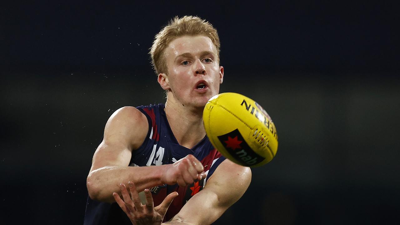 Cam Mackenzie dishes out a handball. Picture: Daniel Pockett/AFL Photos/via Getty Images