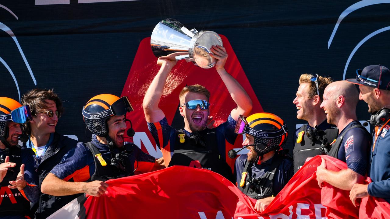 BARCELONA, SPAIN - OCTOBER 04: The AC75 Ineos Britannia team celebrate with the Louis Vuitton Cup after defeating The AC75 Luna Rossa Prada Pirelli Team during the race 11 of the Louis Vuitton Cup Final - 37th America's Cup on October 04, 2024 in Barcelona, Spain. (Photo by David Ramos/Getty Images)