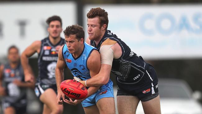 Haren tackles Sturt's Guy Page during his tenure at South Adelaide. Picture: Dean Martin