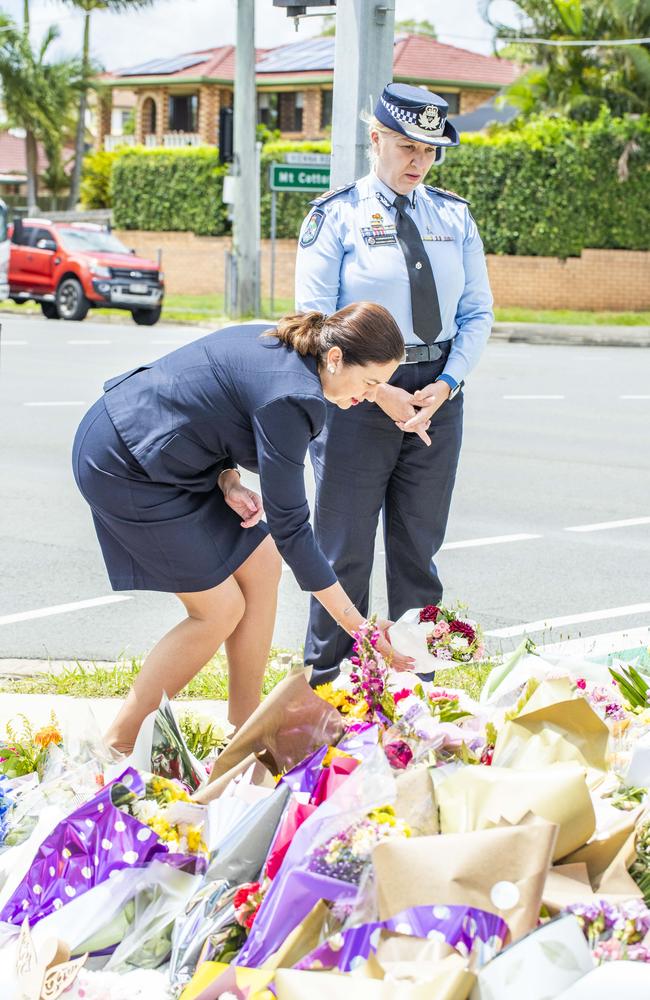 Then premier Annastacia Palaszczuk and police commissioner Katarina Carroll lay flowers for Kate Leadbetter and Matt Field at Alexandra Hills in January 2021.