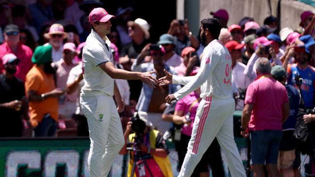 Australian captain Pat Cummins shakes hands with India’s Jasprit Bumrah after Australia won the match on day three of the fifth cricket Test match between Australia and India at The SCG in Sydney on January 5, 2025. (Photo by David Gray/ AFP)