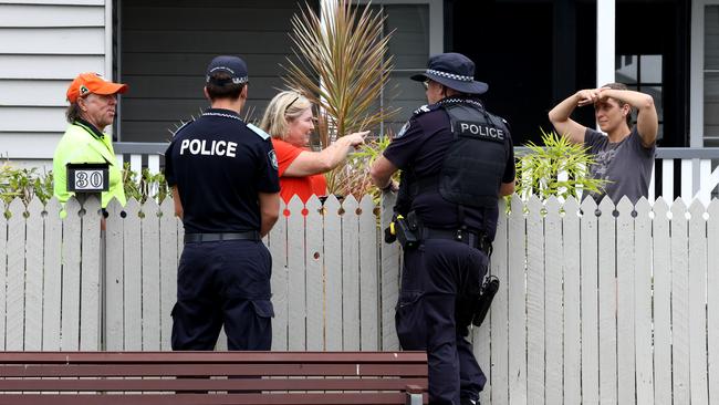 Police doorknock residents at Nudgee Beach. Picture: David Clark