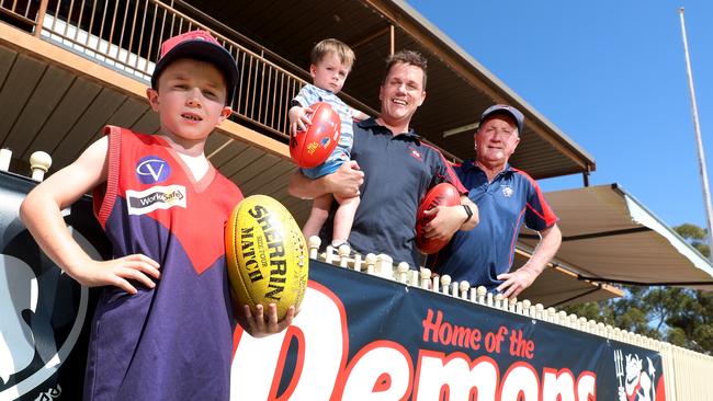 Wycheproof-Narraport has agreed to merge with neighbouring club Nullawil next year in a move welcomed by Paul White, right, his son Rory and his children, Teddy, 3 and Billy, 8. Picture: Yuri Kouzmin