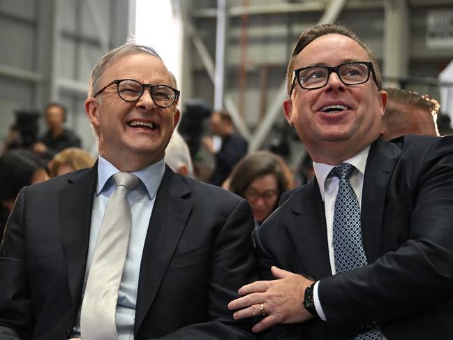 (lt-rt) Adam Goodes, Prime Minister Anthony Albanese and QANTAS CEO Alan Joyce as QANTAS unveil their Yes23 livery being carried on some of their aircraft at Sydney Domestic Airport in Sydney, Monday, August 14, 2023. (AAP Image/Dean Lewins) NO ARCHIVING