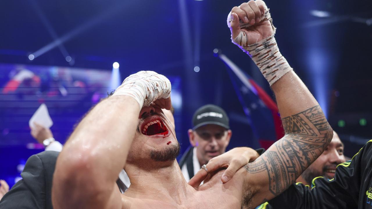 Opetaia celebrates his win for the IBF cruiserweight title on the Gold Coast.