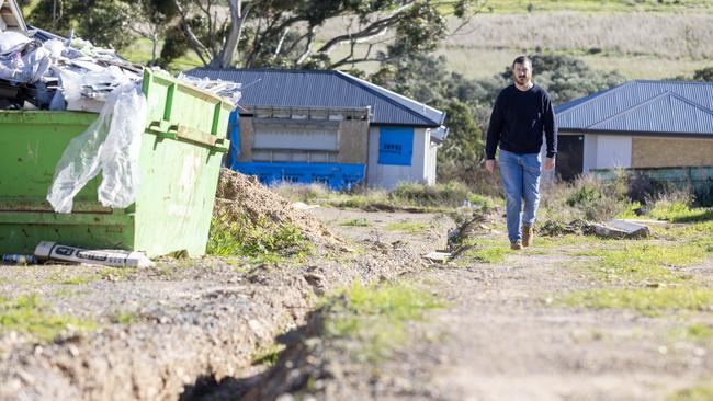 Edward Gilmore with his unfinished home after the collapse of the Felmeri Group in O'Halloran Hill. Picture: Kelly Barnes