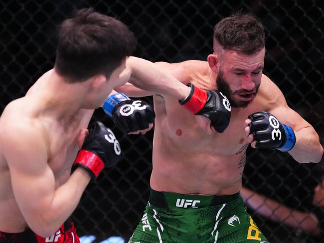 LAS VEGAS, NEVADA - DECEMBER 09: (L-R) HyunSung Park of South Korea punches Shannon Ross of Australia in a flyweight fight during the UFC Fight Night event at UFC APEX on December 09, 2023 in Las Vegas, Nevada. (Photo by Jeff Bottari/Zuffa LLC via Getty Images)