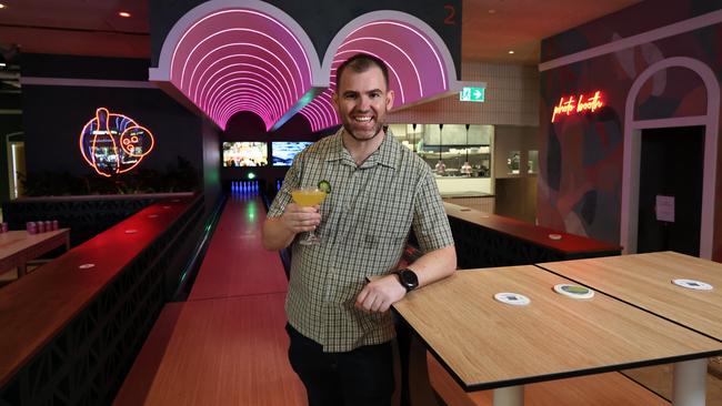 Mexicairns is Cairns' latest entertainment venue, featuring Mexican food and drinks, six classic game zones, lounges, and an agave bar selling Cairns' largest range of tequila. Mexicairns owner Pete McLeay enjoys a mango margarita in the venue's bowling alley. Picture: Brendan Radke