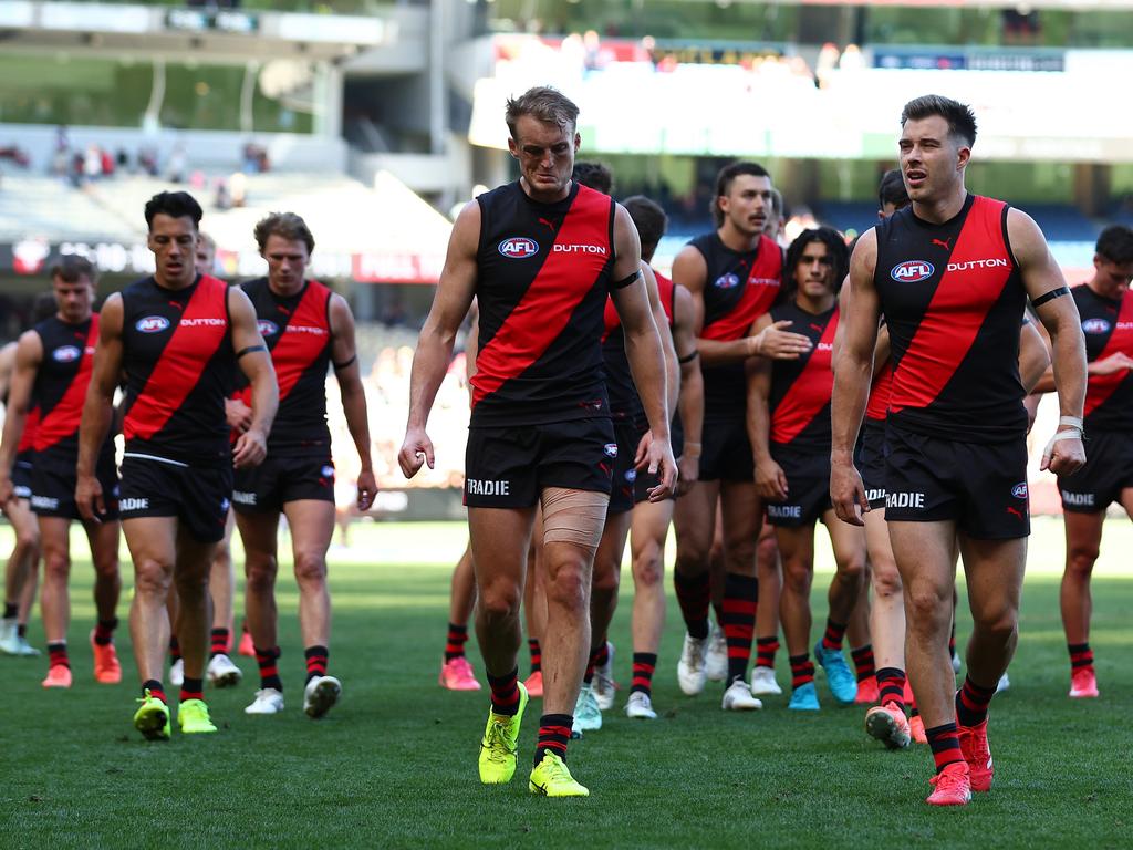 Zach Merrett leads his side off after fighting a lone hand against the Crows.