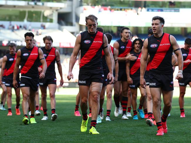 Zach Merrett leads his side off after fighting a lone hand against the Crows.