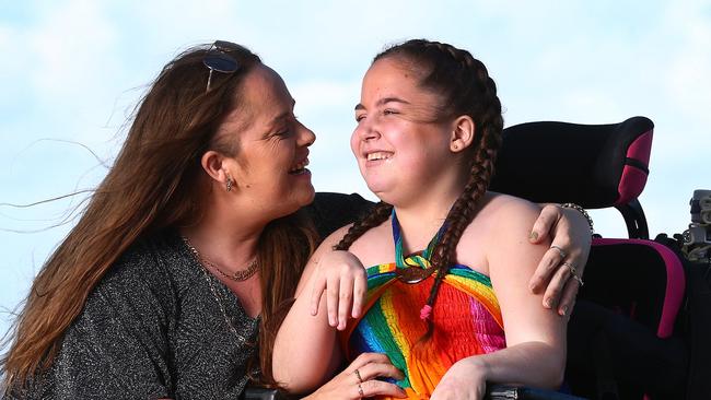 Kaitlyn Spraggon, who suffers from a severe disability, and her mother Katrina, who has claimed that her daughter was told there would be no graduation ceremony for Year 6 students at Caboolture Special School, and then later found out there was one. They are holidaying on the Gold Coast. Pics Adam Head