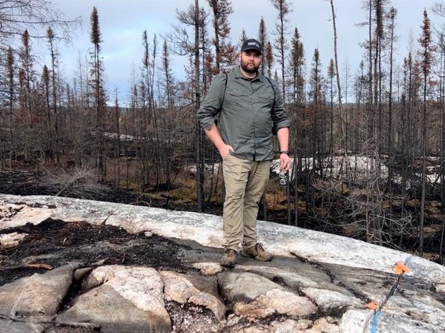 James Bay Minerals CEO Andrew Dornan standing on top of the Warhawk pegmatite. Picture: JBY