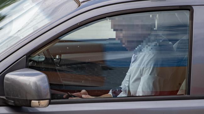 A man is caught texting behind the wheel in Lidcombe on Friday. Picture: AAP 