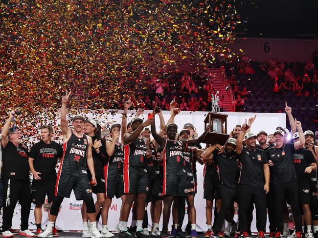 Illawarra Hawks celebrate with the championship trophy. Picture: Mark Metcalfe/Getty Images.