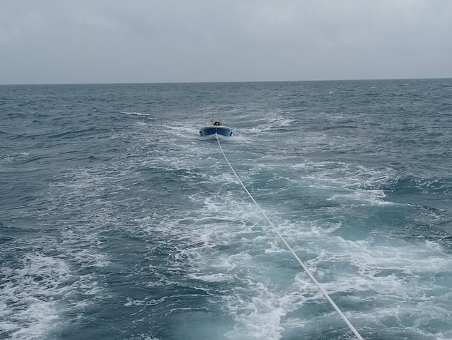 Two Aussie fisherman have been rescued from two-metre seas by Australian Border Force officers after their dinghy’s engine broke down in the Torres Strait.