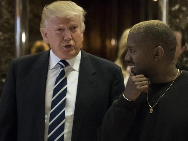 NEW YORK, NY - DECEMBER 13: (L to R) President-elect Donald Trump and Kanye West walk into the lobby at Trump Tower, December 13, 2016 in New York City. President-elect Donald Trump and his transition team are in the process of filling cabinet and other high level positions for the new administration. (Photo by Drew Angerer/Getty Images)