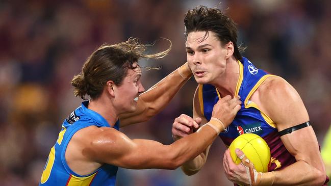 BRISBANE, AUSTRALIA - MAY 05: Eric Hipwood of the Lions is tackled during the round eight AFL match between Brisbane Lions and Gold Coast Suns at The Gabba, on May 05, 2024, in Brisbane, Australia. (Photo by Chris Hyde/AFL Photos/via Getty Images )