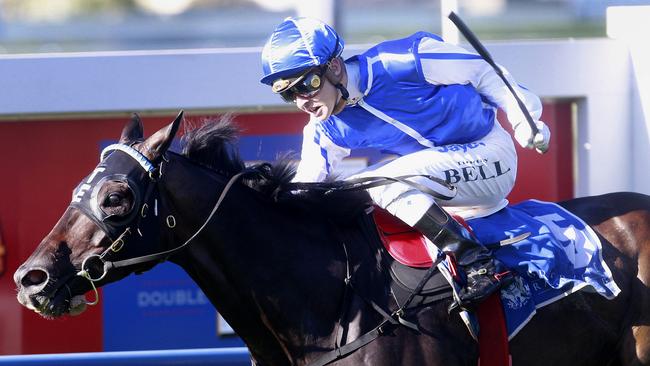 War Ends racing at Doomben in 2013. Picture: Jono Searle