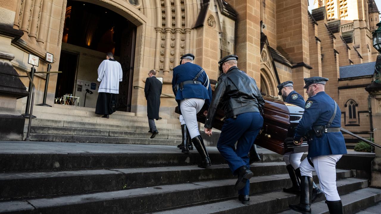 Bob Fulton's casket arrives at his state funeral at St Mary's Cathedral on Friday. Picture: AAP Image/James Gourley