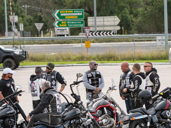 Members meeting up at a service station south of Wodonga with police also in force. Picture: Simon Dallinger.