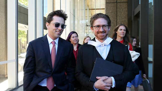 Journalist Joe Aston leaving Federal court with his lawyer in the defamation trial against Elaine Stead. Jane Dempster/The Australian.