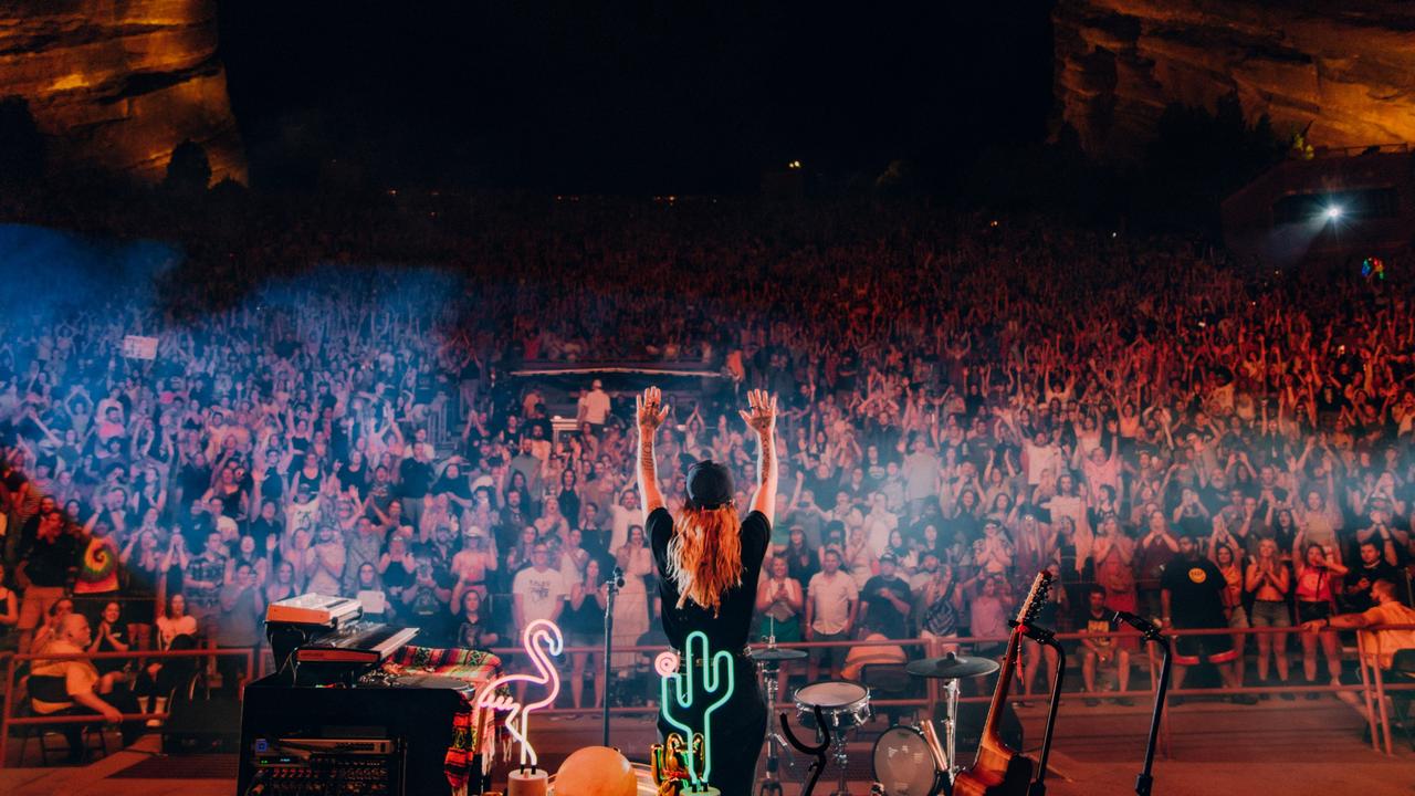 Tash Sultana performs at the iconic Red Rocks amphitheatre in Colorado to an enormous crowd. Picture: Ryan Jafarzadeh/Supplied.