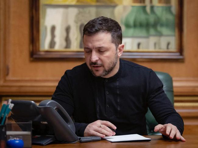 President Volodymyr Zelenskyy speaking during a phone call with the US president while sitting at his office in Kyiv, amid the Russian invasion of Ukraine. Picture: Handout / UKRAINIAN PRESIDENTIAL PRESS SERVICE / AFP