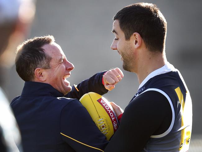 18/07/18 - AFL - Crows training (warm-up only) at Football park. Senior Coach Don Pyke has a good laugh as he demonstrates his boxing technique as he pretends to punch his Captain Taylor Walker Picture SARAH REED