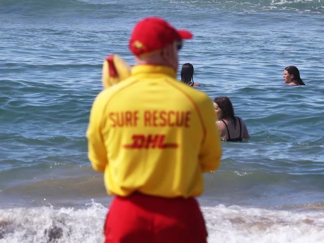 A Lifeguard looks on at Burleigh Heads after a recent run of shark sightings on the Gold Coast.Photograph : Jason O'Brien