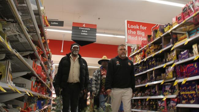 Robin Granites, the grandfather of a 24-year-old man from Yuendumu walks through aisle four in Coles Alice Springs during a vigil for the young man. The young man died in custody inside the supermarket on May 27, 2025, in aisle four, the lolly aisle. Picture: Gera Kazkov