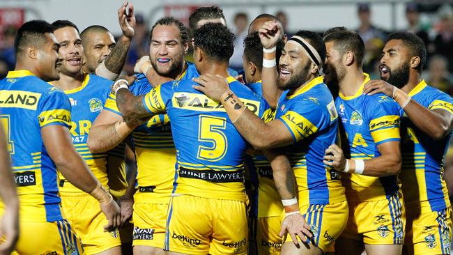 Eels celebrate the first try of the game against the North Queensland Cowboys.
