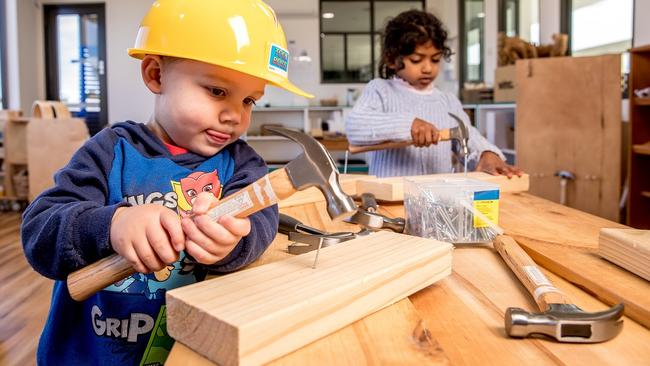 Darcy, 2, and Eden, 4, create woodwork projects in the risk-taking space. Picture: Tim Carrafa