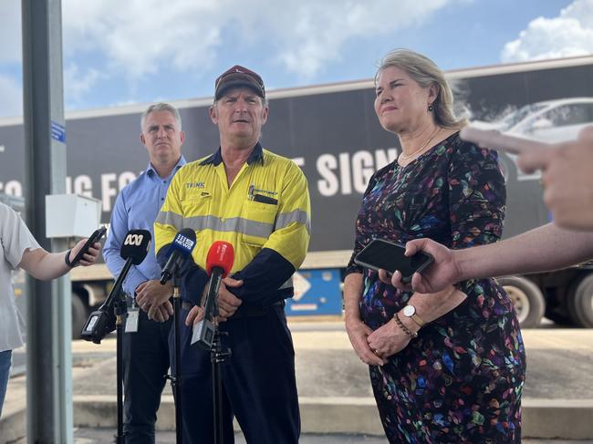 Infrastructure Minister Joel Bowden, trucker Andrew Ailmore and Chief Minister Eva Lawler announce fresh food is back on Top End shelves after floods disrupted supply. Picture: Fia Walsh